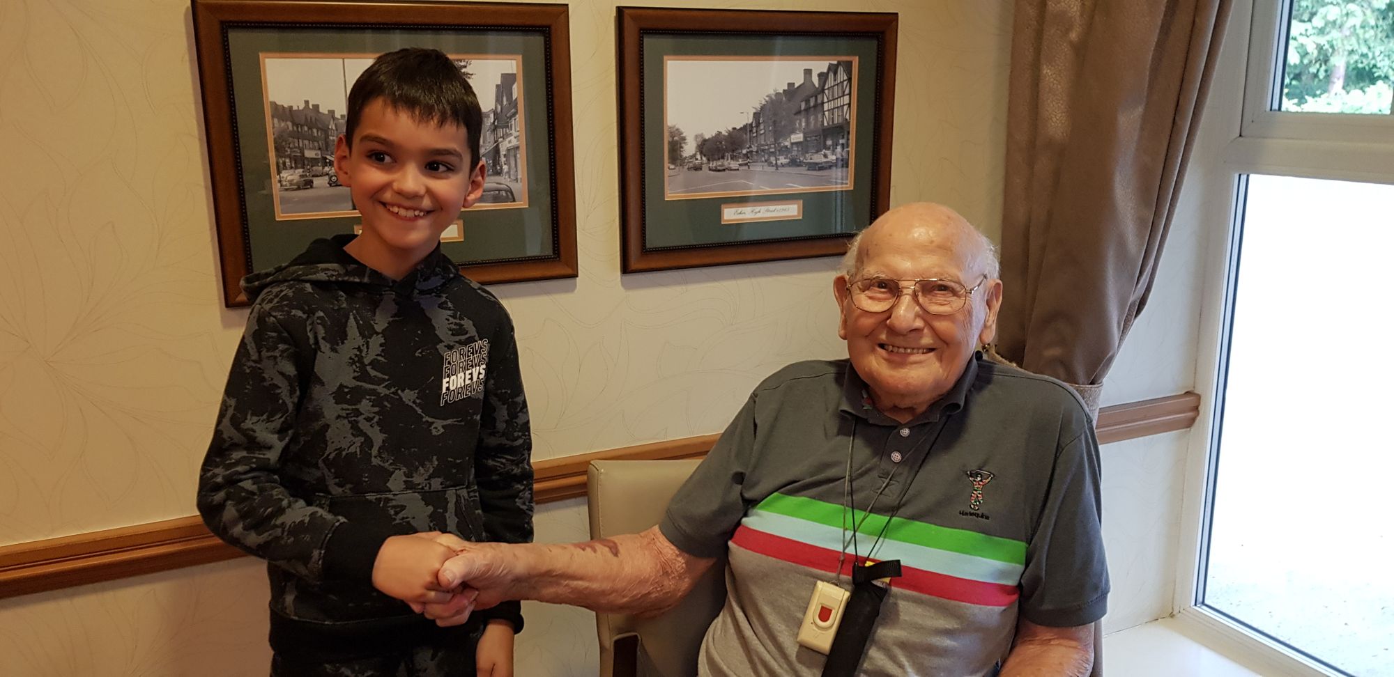 Esher World War Two hero shares tales with nine-year-old care home volunteer