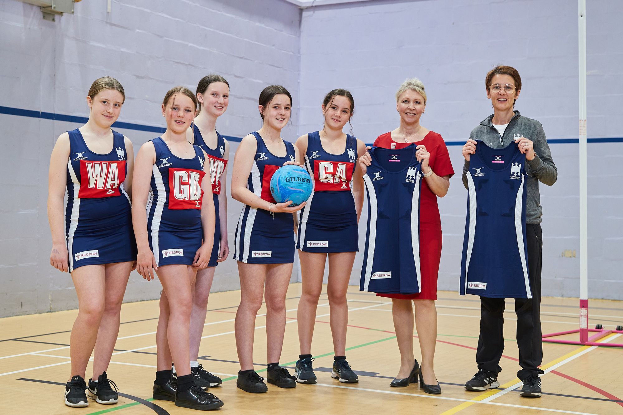 Knutsford school netball teams score support from homebuilder