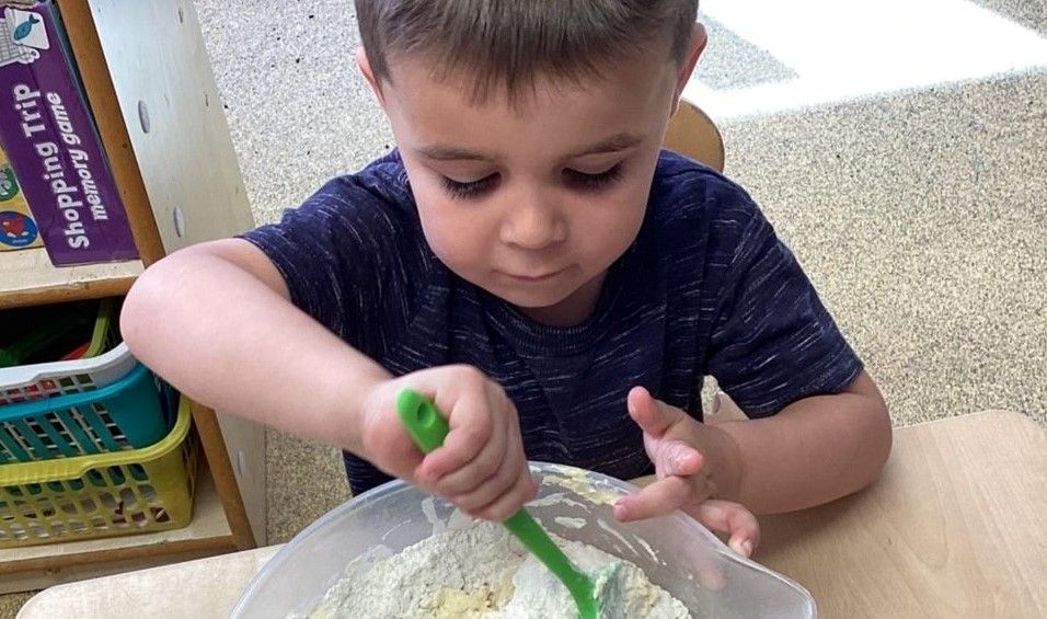 Hinckley nursery children practice physical skills at 'Creative Cooks' session