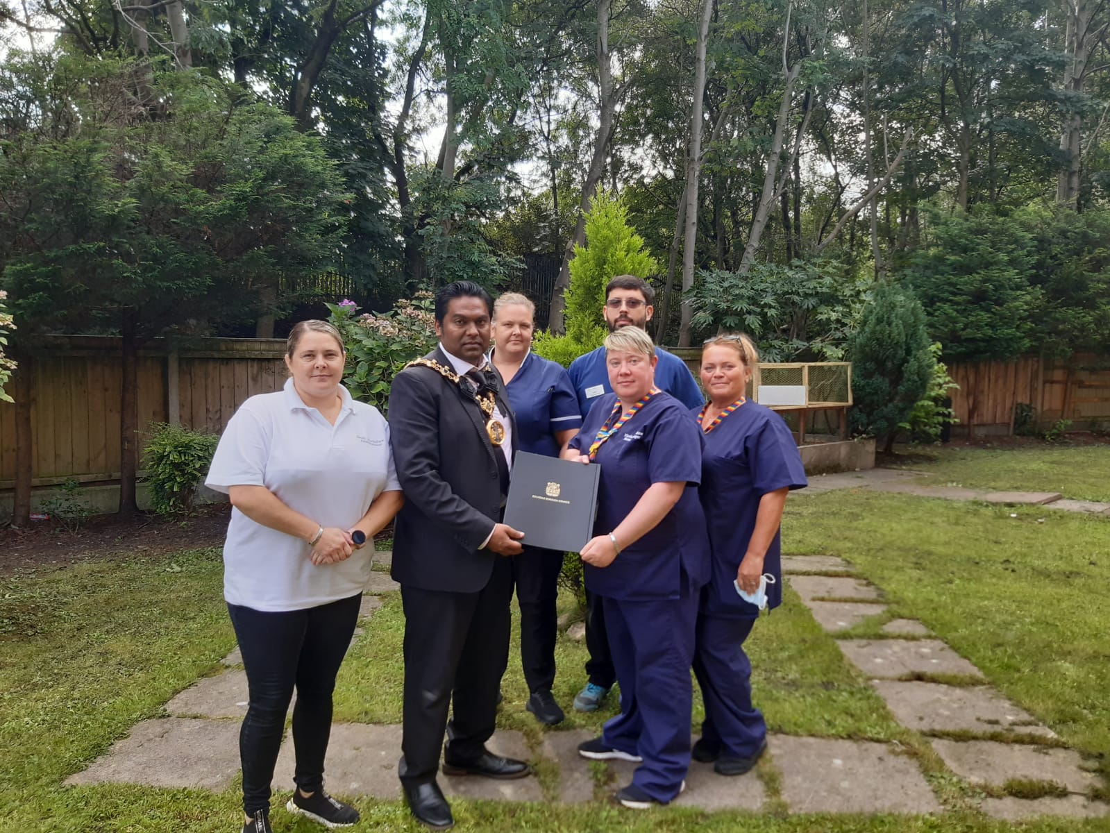 Rochdale Mayor visits care homes so residents can sign book of condolence for Queen