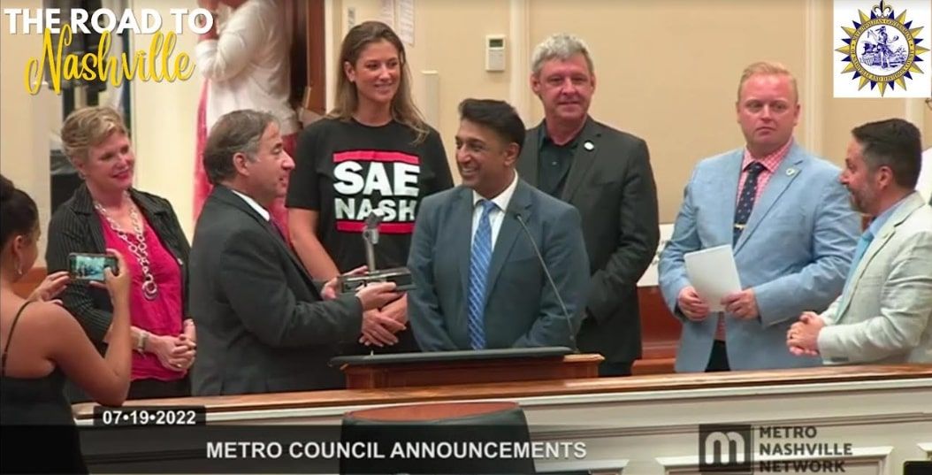 Liverpool hands over the Beatles Mic of Unity to Nashville