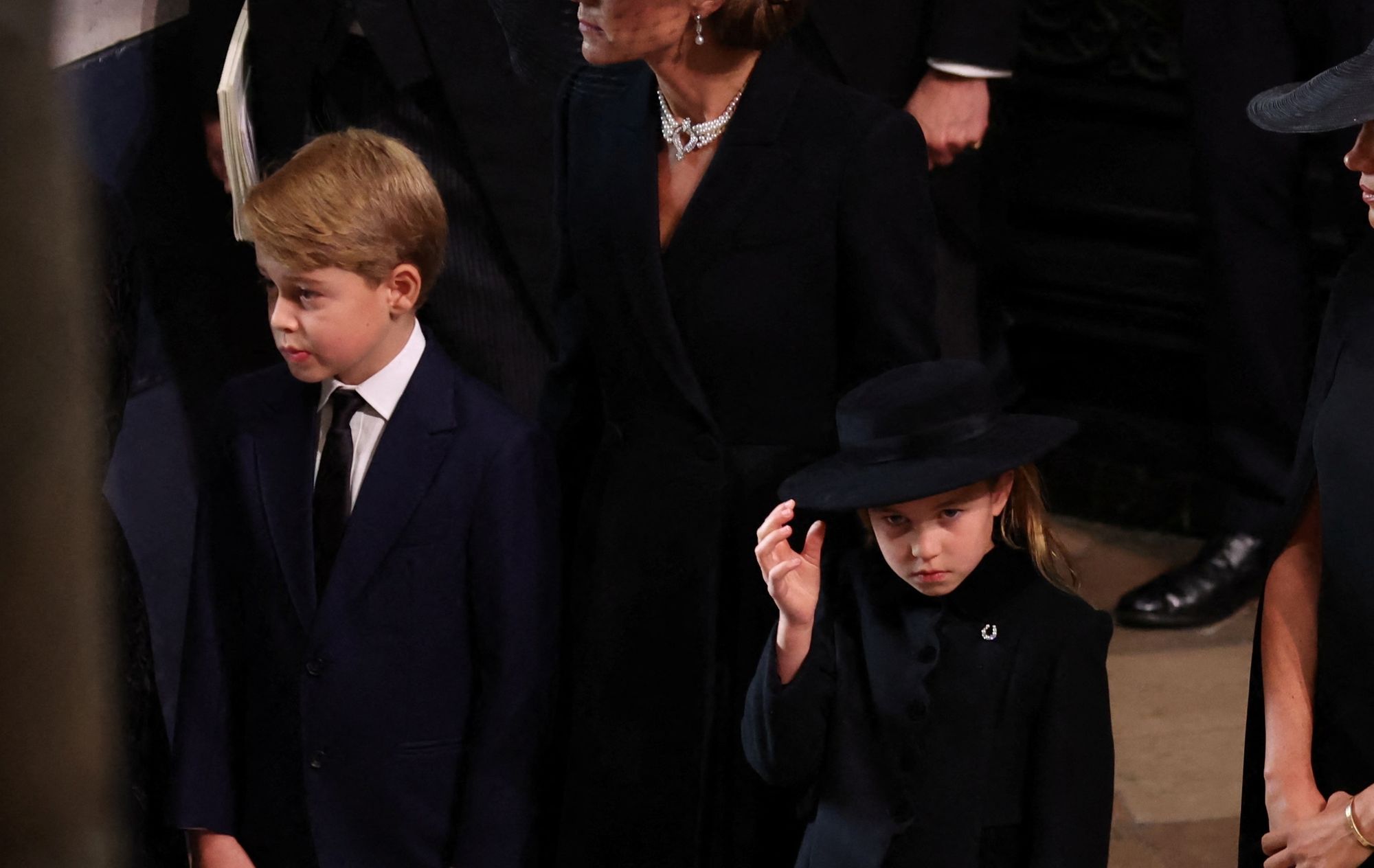 Prince George and Princess Charlotte march behind 'Gan Gan's' coffin as nation pays its respects to Queen at funeral