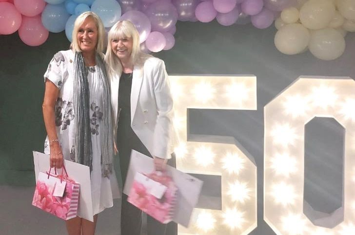 Work colleagues celebrate their 50-year work anniversaries at M&S in Southport