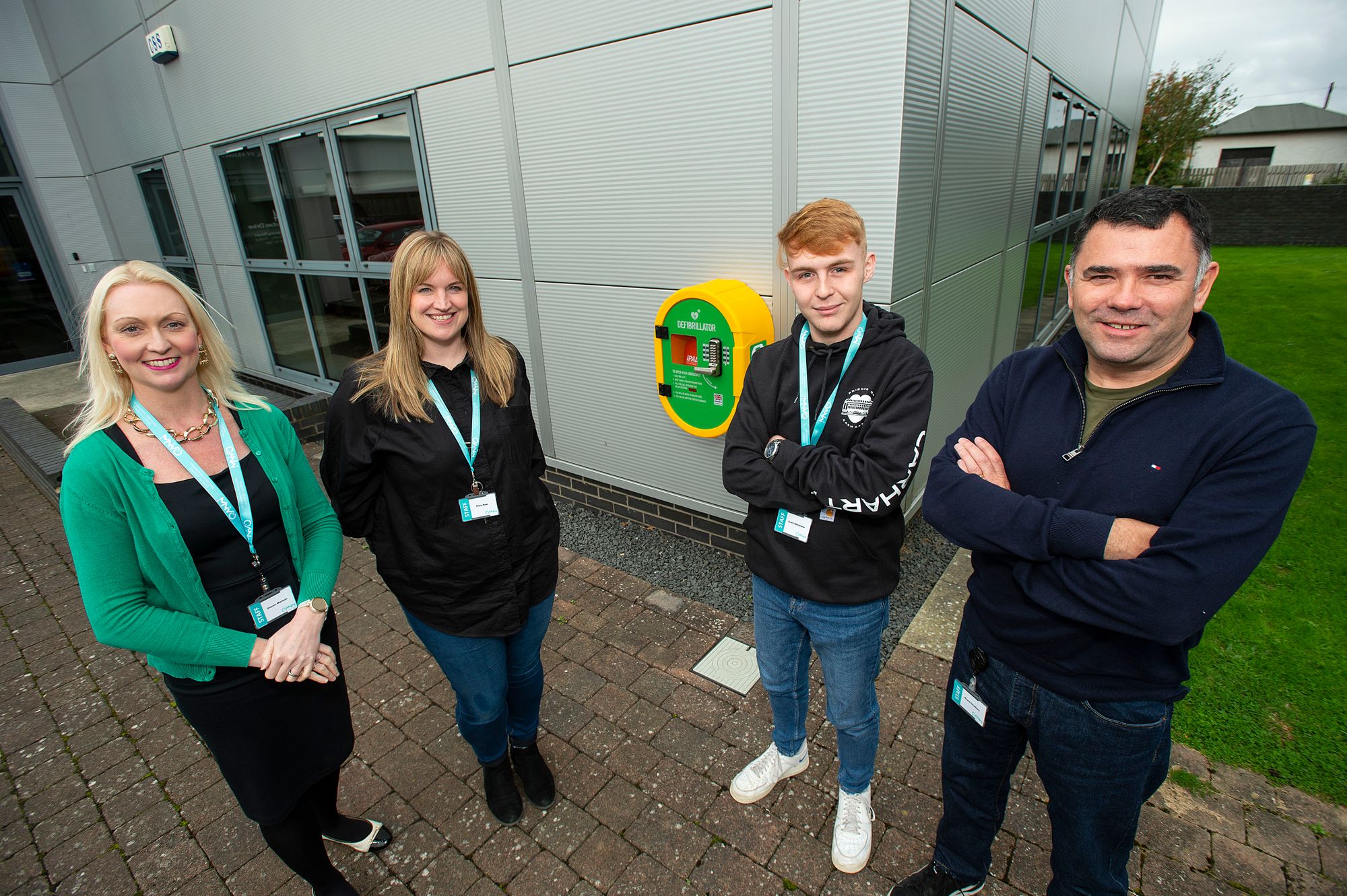 It's a team effort as employees at Ayrshire insurance provider raise funds to have life saving defibrillator installed