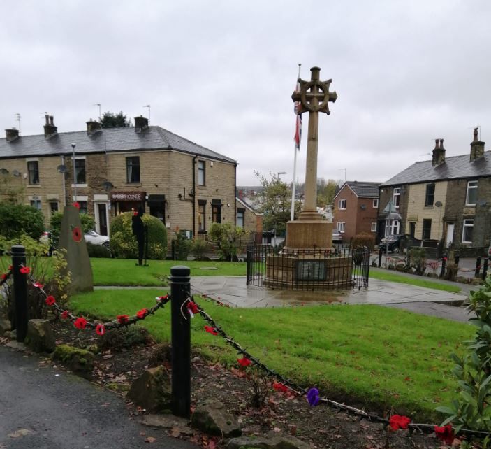 Norden WI adorn memorial garden with knitted poppies