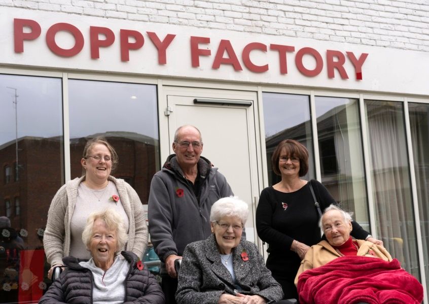 Poppy factory visit evokes wartime memories for Guildford care home residents