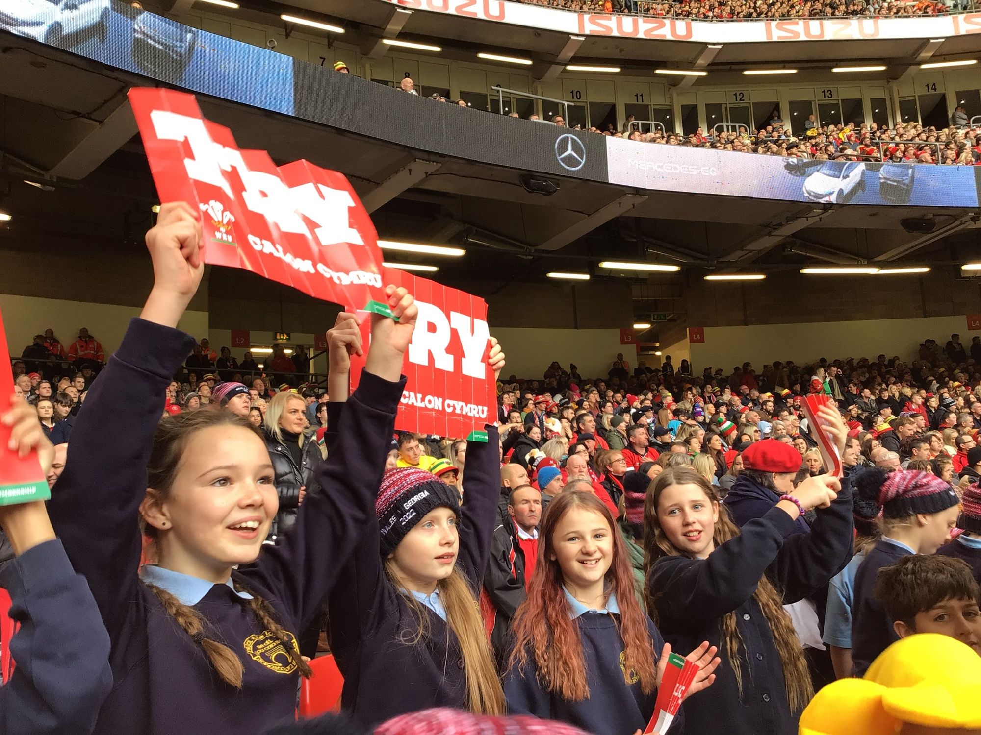 Carmarthen pupils sing at Principality Stadium during Wales autumn international rugby match