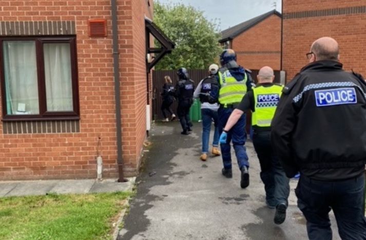 Six in court in burglary probe after raids in Runcorn and Manchester