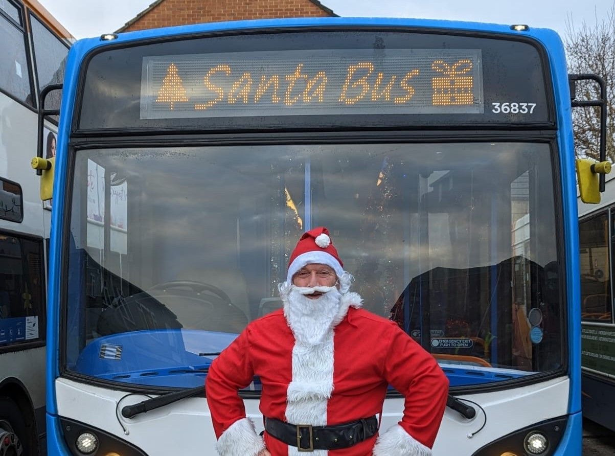 Santa drives Surrey and Hampshire bus for Save the Children Christmas