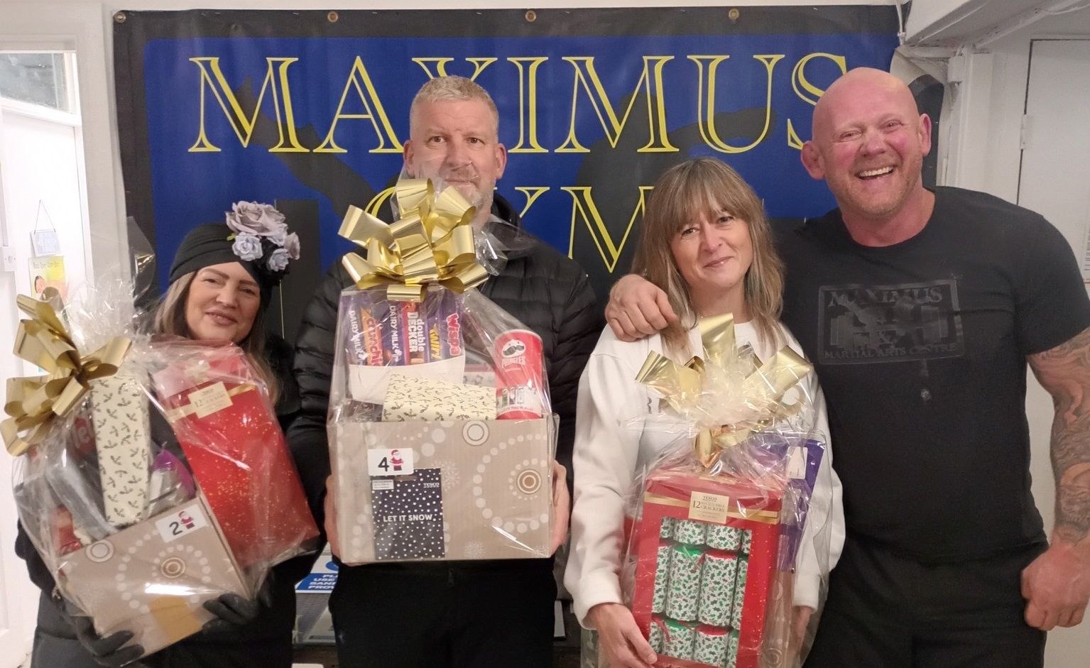 Surrey Heath gym brightens Christmas for vulnerable families with hamper donation