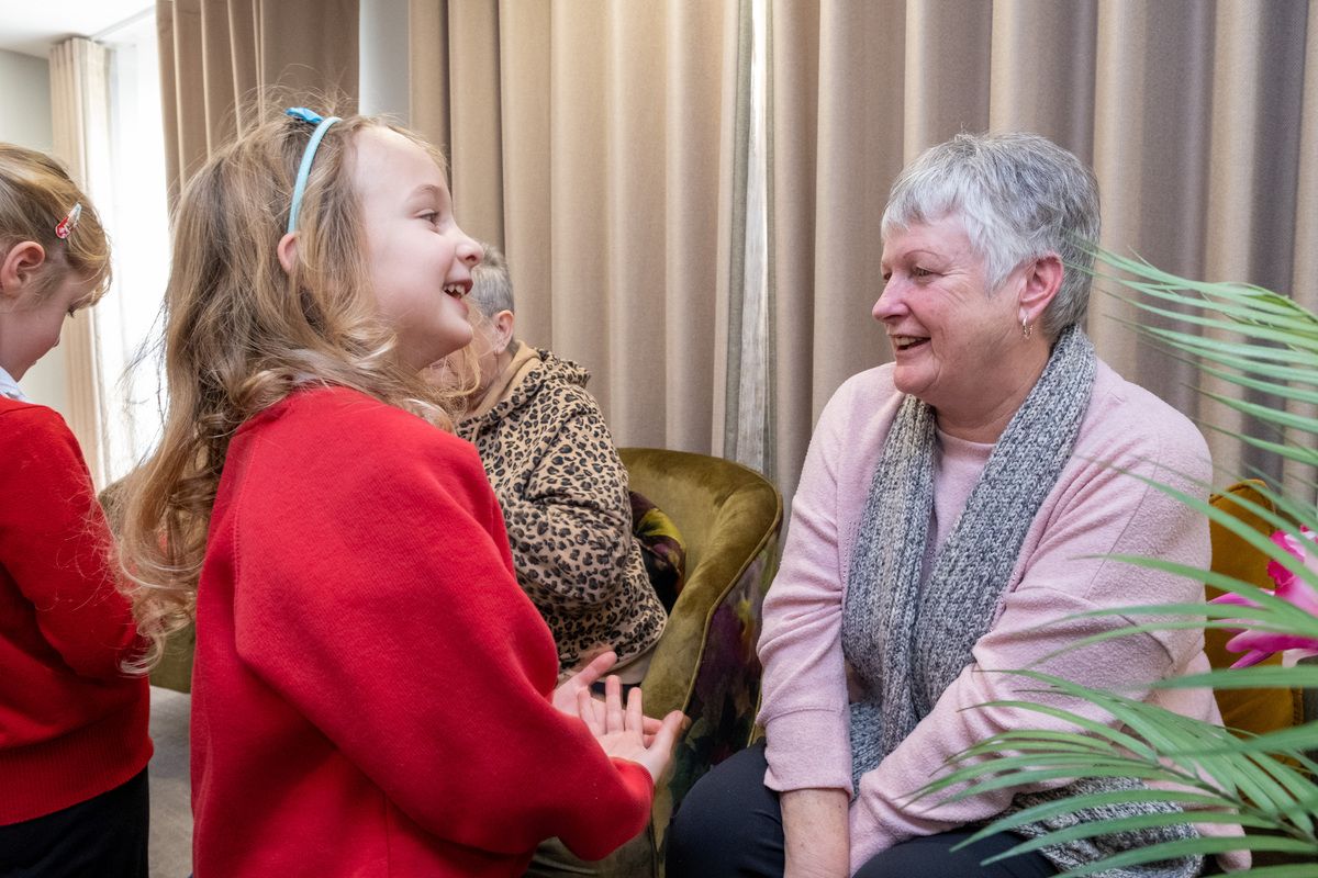 Buxton Infants bring festive cheer to Devonshire Place residents