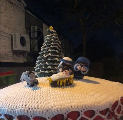 Castleton woman who is registered blind behind decorative crochet postbox toppers
