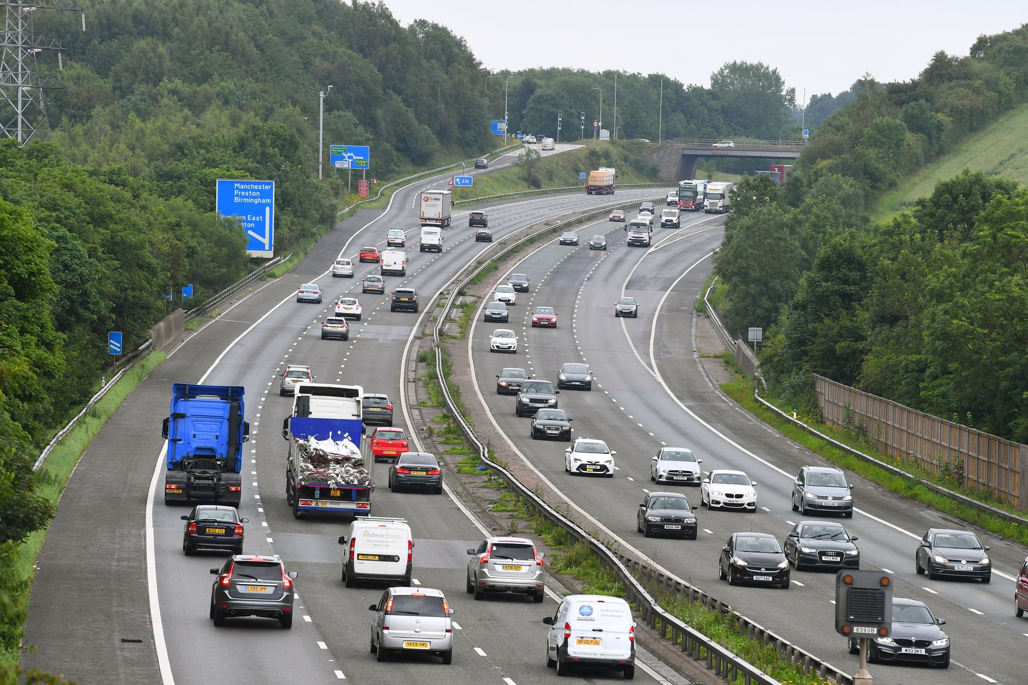 Three injured as car overturns on M56 motorway