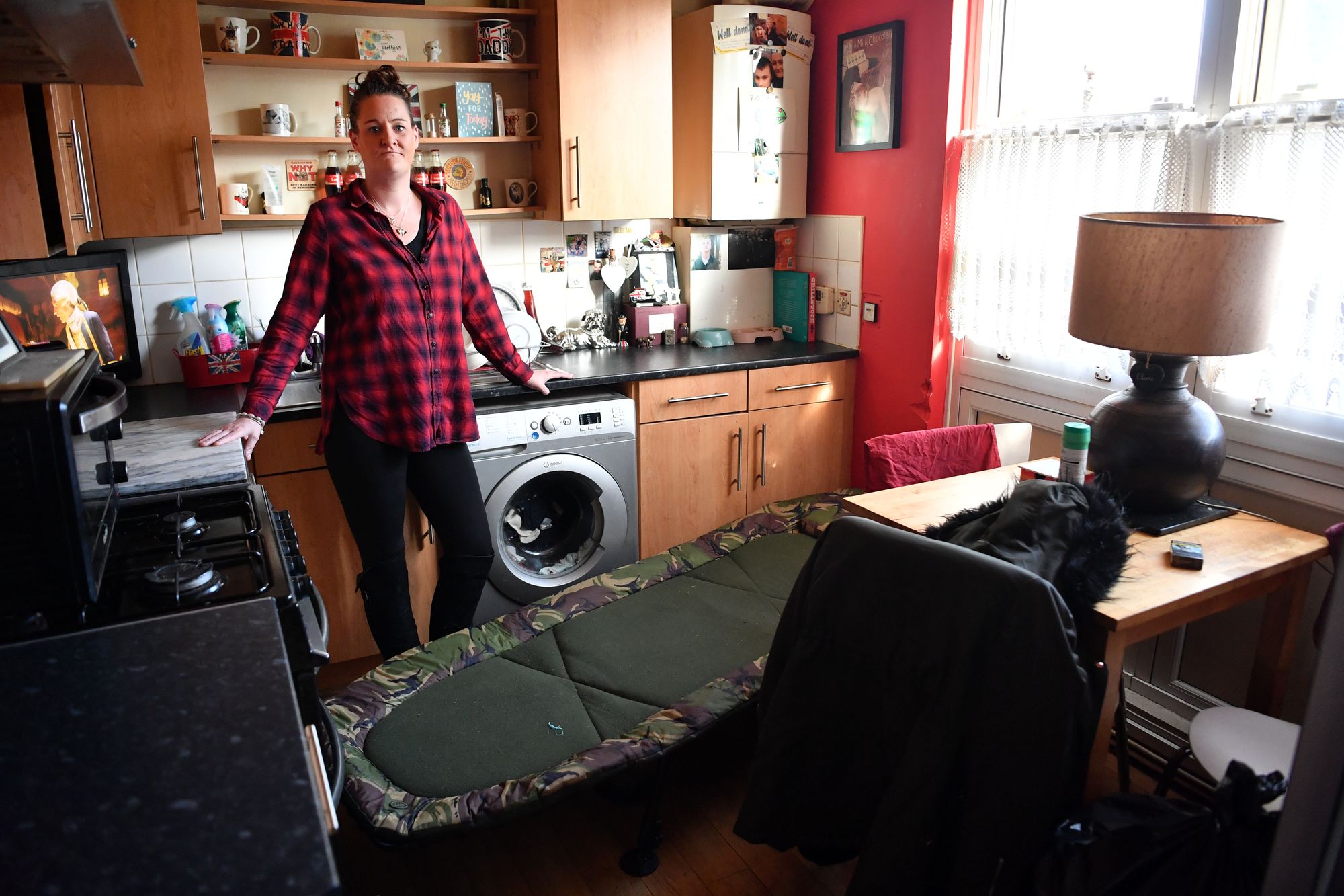 Single mum left sleeping on camp bed in kitchen due to black mould