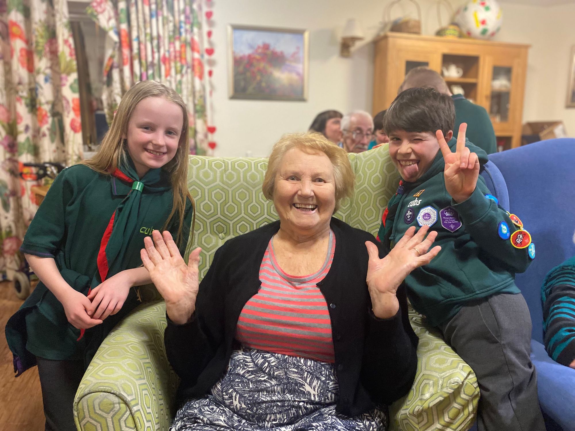 Winchester Cubs sing campfire songs with dementia residents for Founder's Day