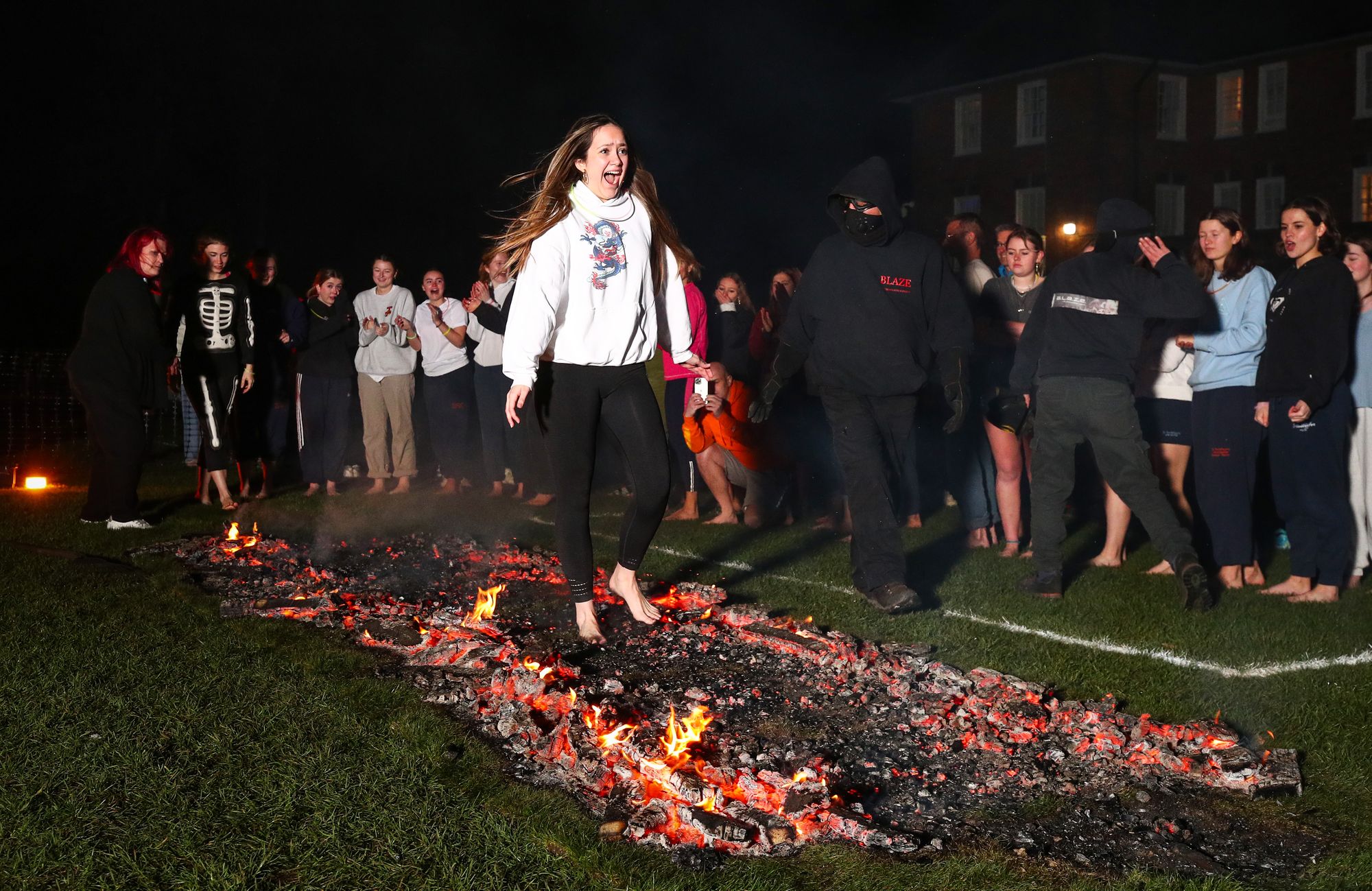 St Swithun’s students walk on fire for Bramston Bursary Foundation