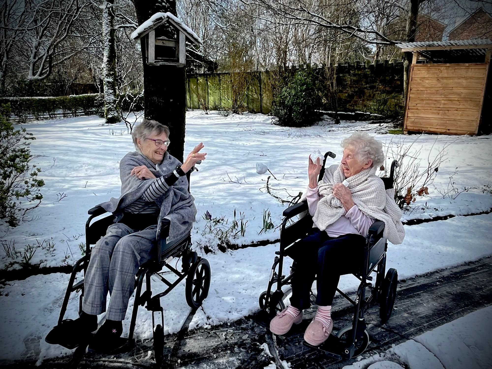 Rochdale care home residents enjoy playing in the snow