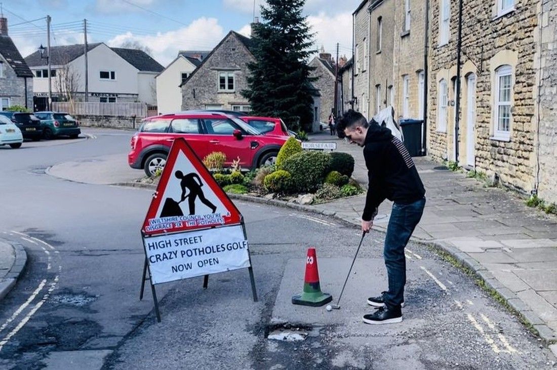 Angry residents play crazy golf on street plagued with potholes
