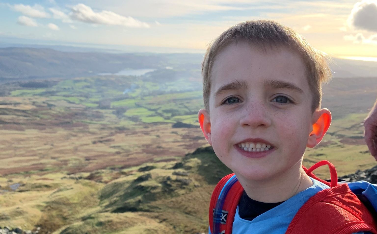Boy, six, scales twelve UK mountains to help poorly children go on holiday