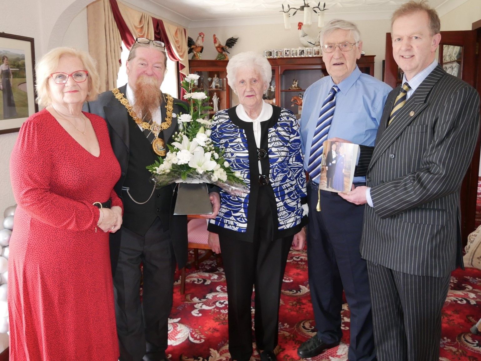 Diamond Wedding Anniversary couple toast their special milestone