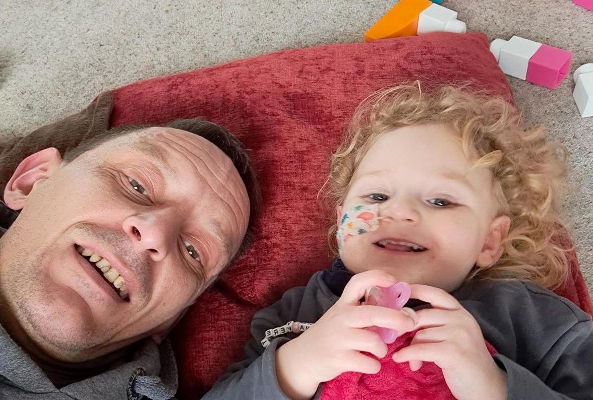 Dad takes on 10,000ft skydive after baby daughter's brain tumour