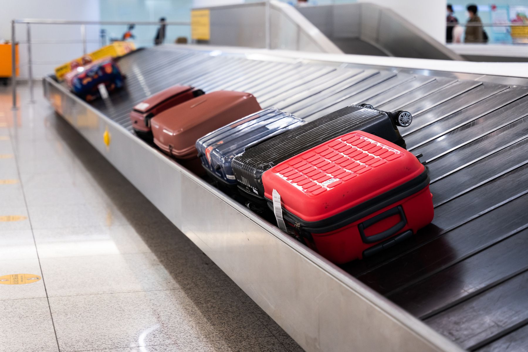Clever tricks and tips to make sure your suitcase is first off the plane