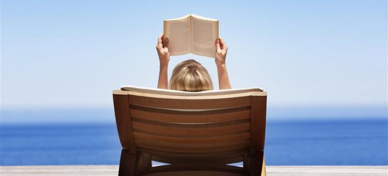 1191664 gs woman reading on lounger 74180467 getty 1 1