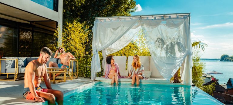 777421 vibe group of friends by the pool 1298732839 getty1