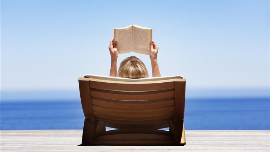 1191664 gs woman reading on lounger 74180467 getty 1 1