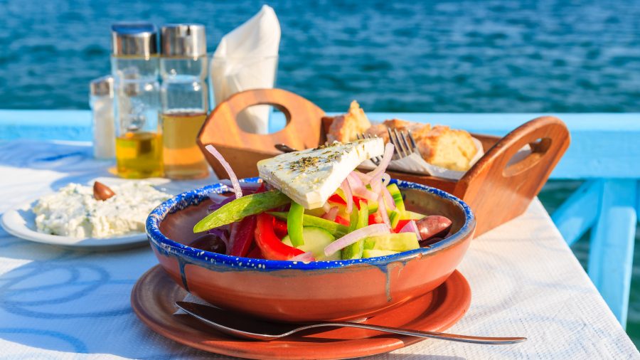 782792 greek tavern with blue sea water 652384634 getty