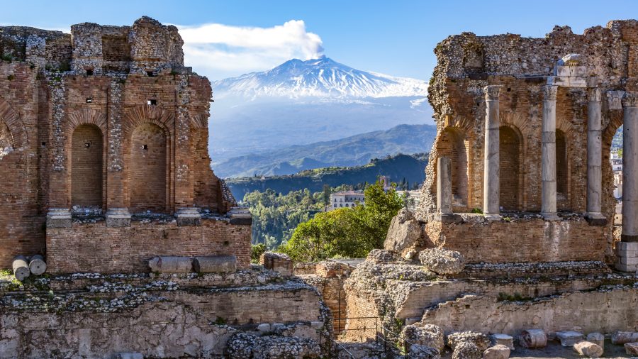 845327 cta etna through amphitheater in taormina 1125673558 getty