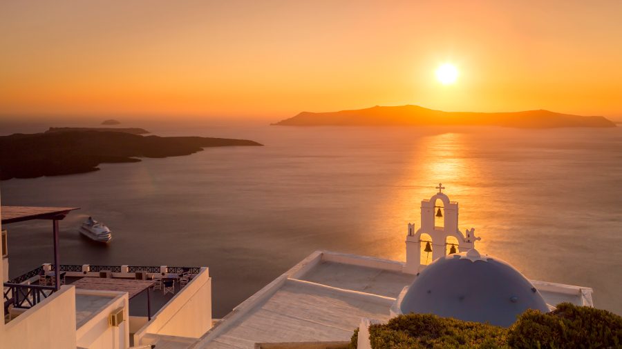 988575 jtr sunset in santorini island 601907962 getty