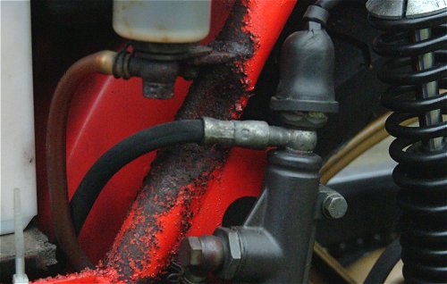 Ewwww. Brake fluid meets frame, hangs around for a decade or two...