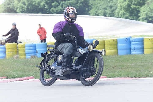 Stuart at Montlhery. Helmet hides beard and big grin.