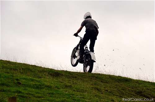 Left at the top of the hill. You can't miss it.