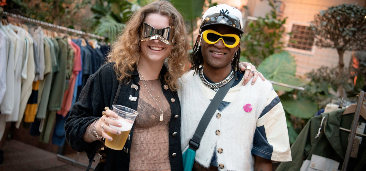 Couple wearing sunglasses, smiling at camera - TLS 2024 (c) Colin Davison
