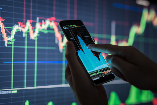 Businessman-checking-stock-market-data.-853584220_1258x838