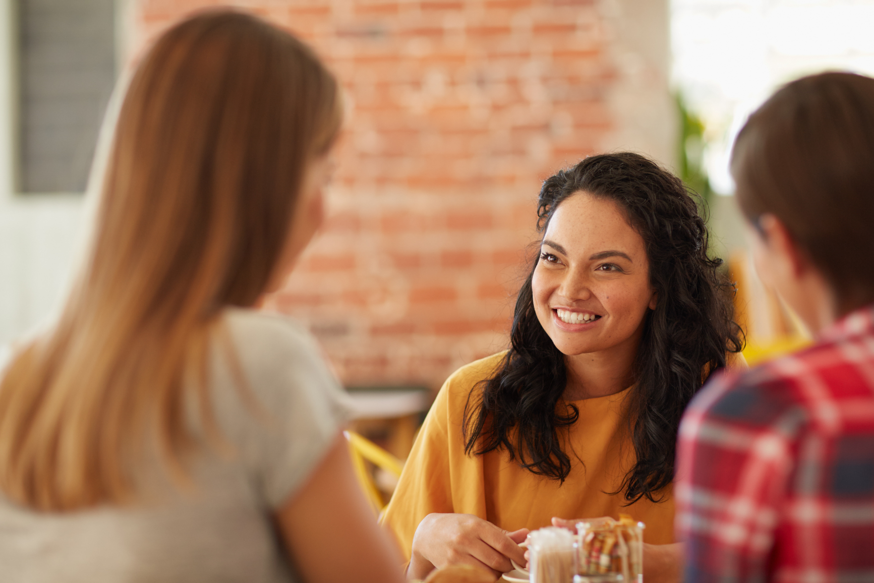 People having a conversation in a cafe