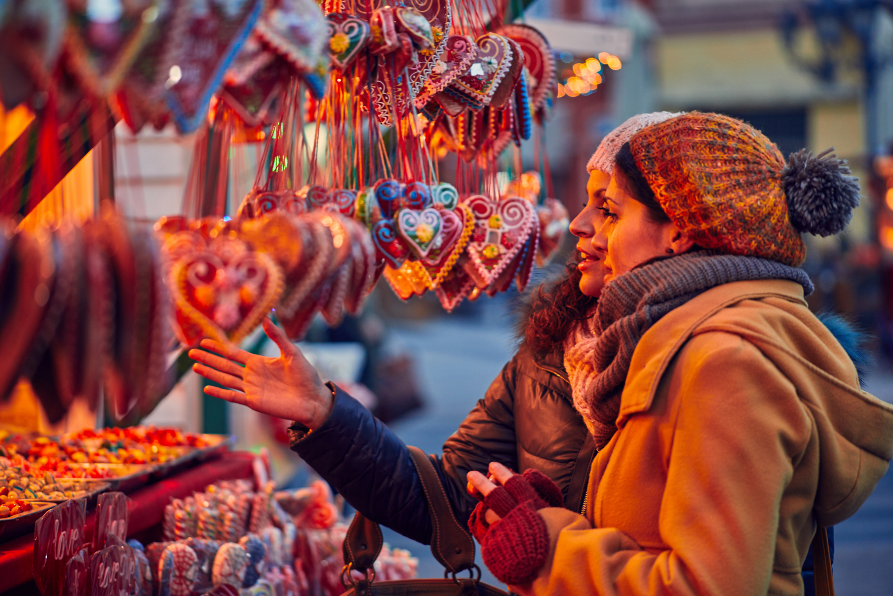 Two women making purchases at a Christmas market