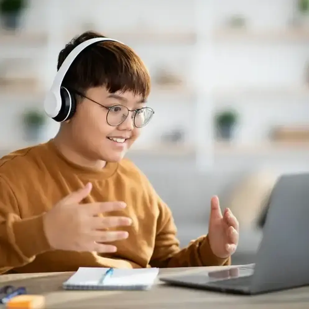 A teenager at a laptop
