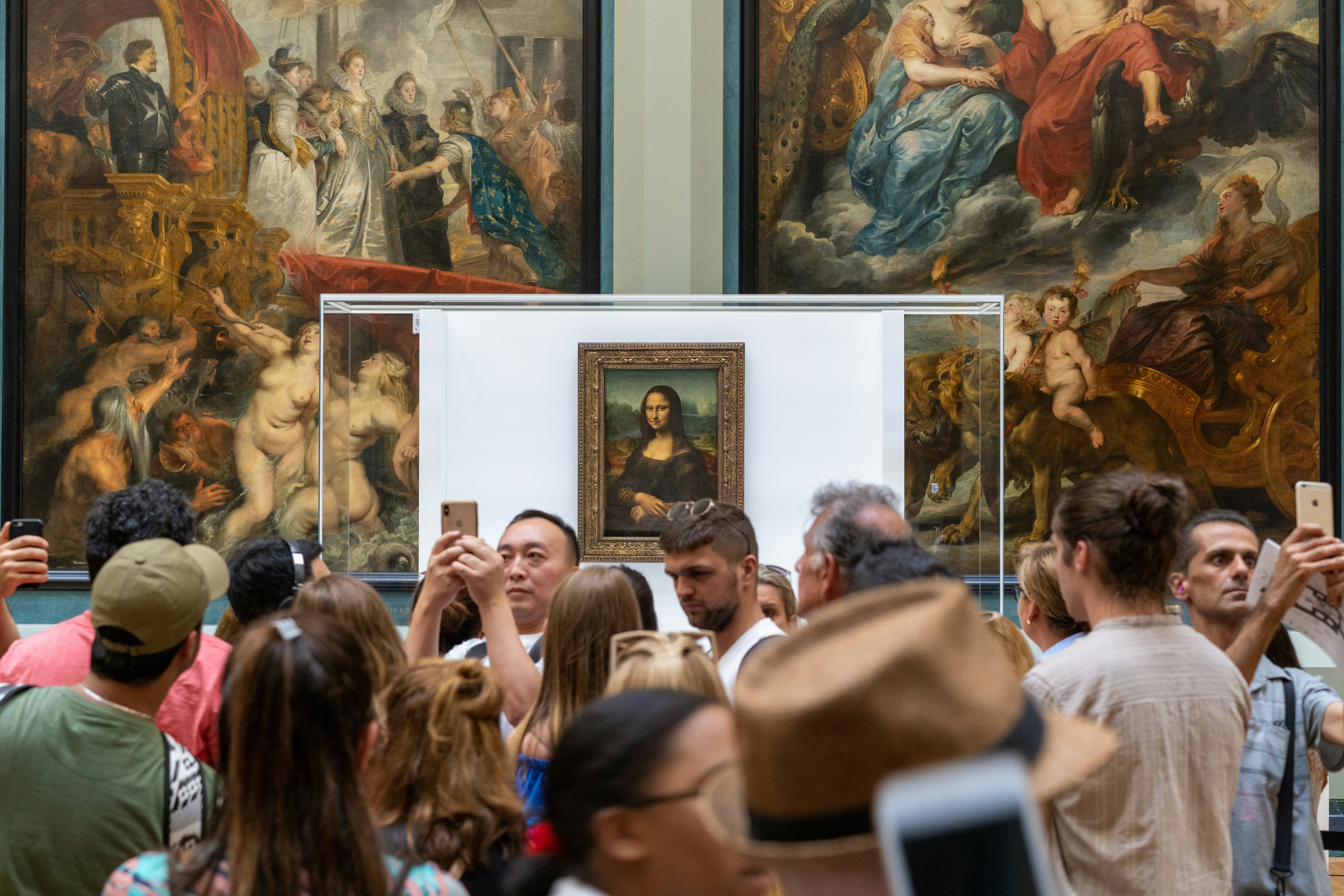 Visitors photographing the Mona Lisa