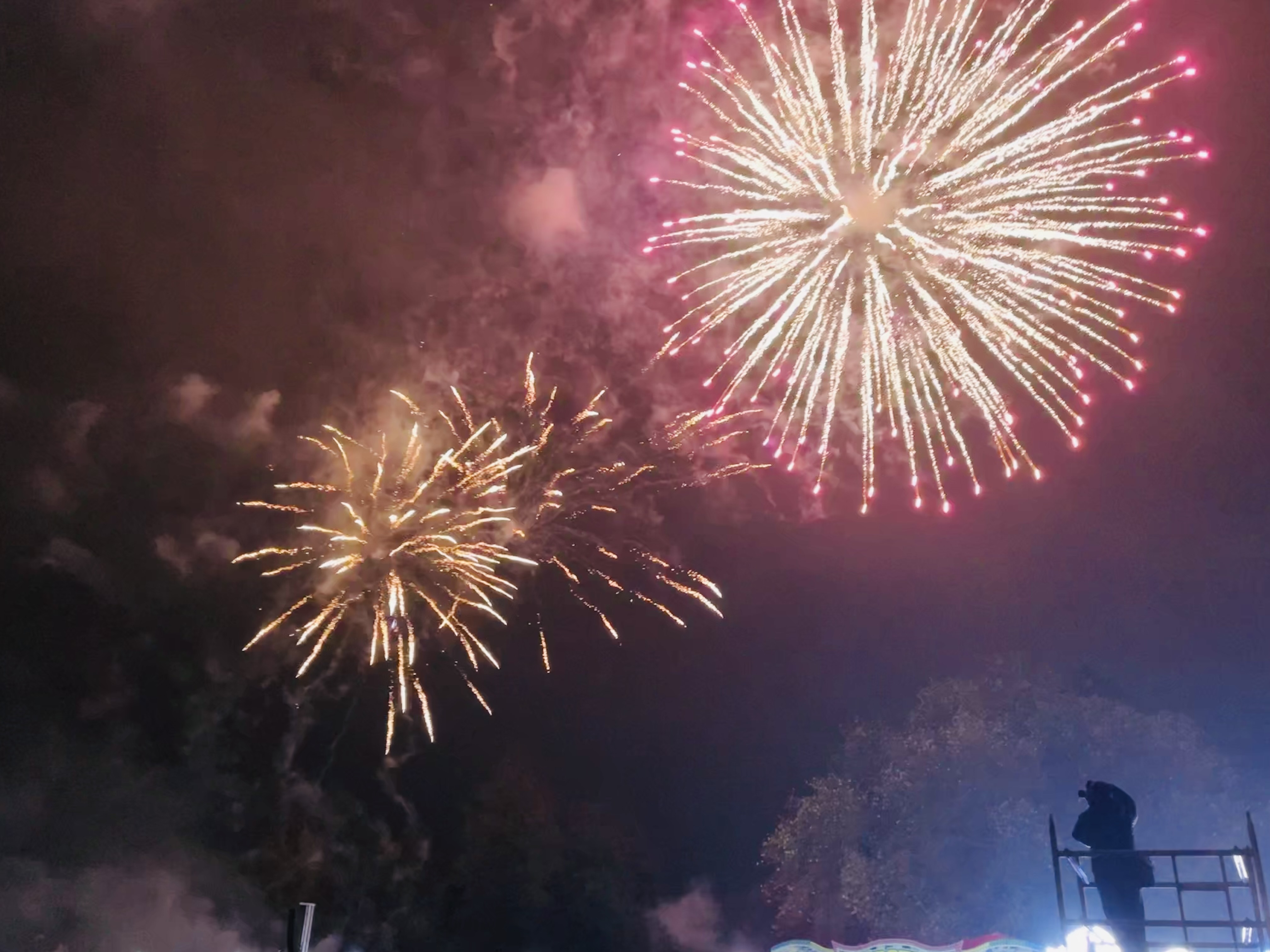 Photo of fireworks with information on the woking Frieworks that is running on Saturday 4th November 2023 with gates opening at 5:30pm and the fireworks starting at 7:30pm there will be a fair running until 9:30pm