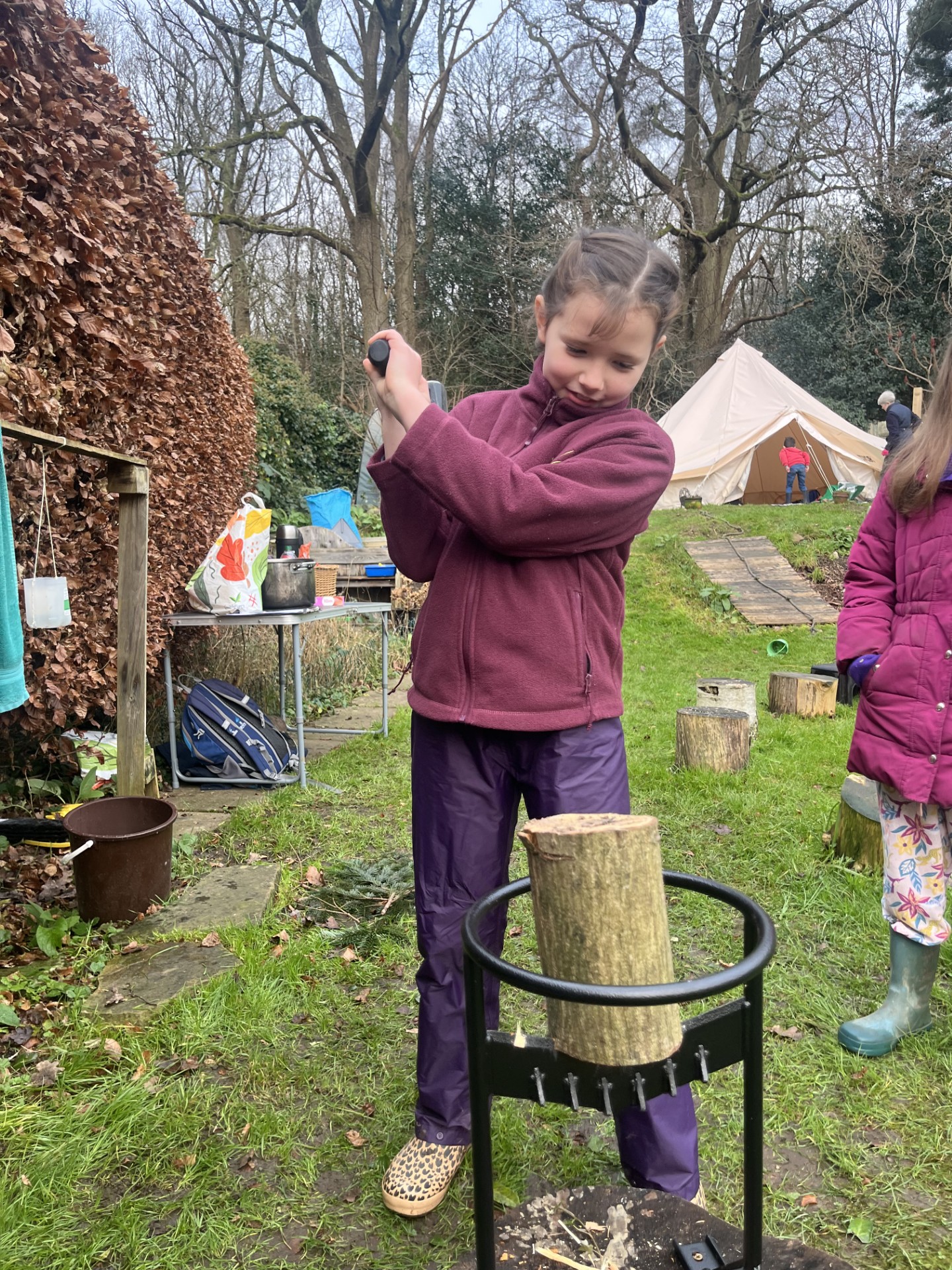 Happy children in the forest standing fiercely with sticks
