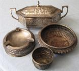 Four pieces of silver. Elaborately decorated with oriental decor.  424 grams gross. Part marked.