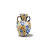 Toso, Fratelli, Murano  Kleine Henkelvase 'Murrine', um 1910  H. 7,4 cm. Farbloses Glas,