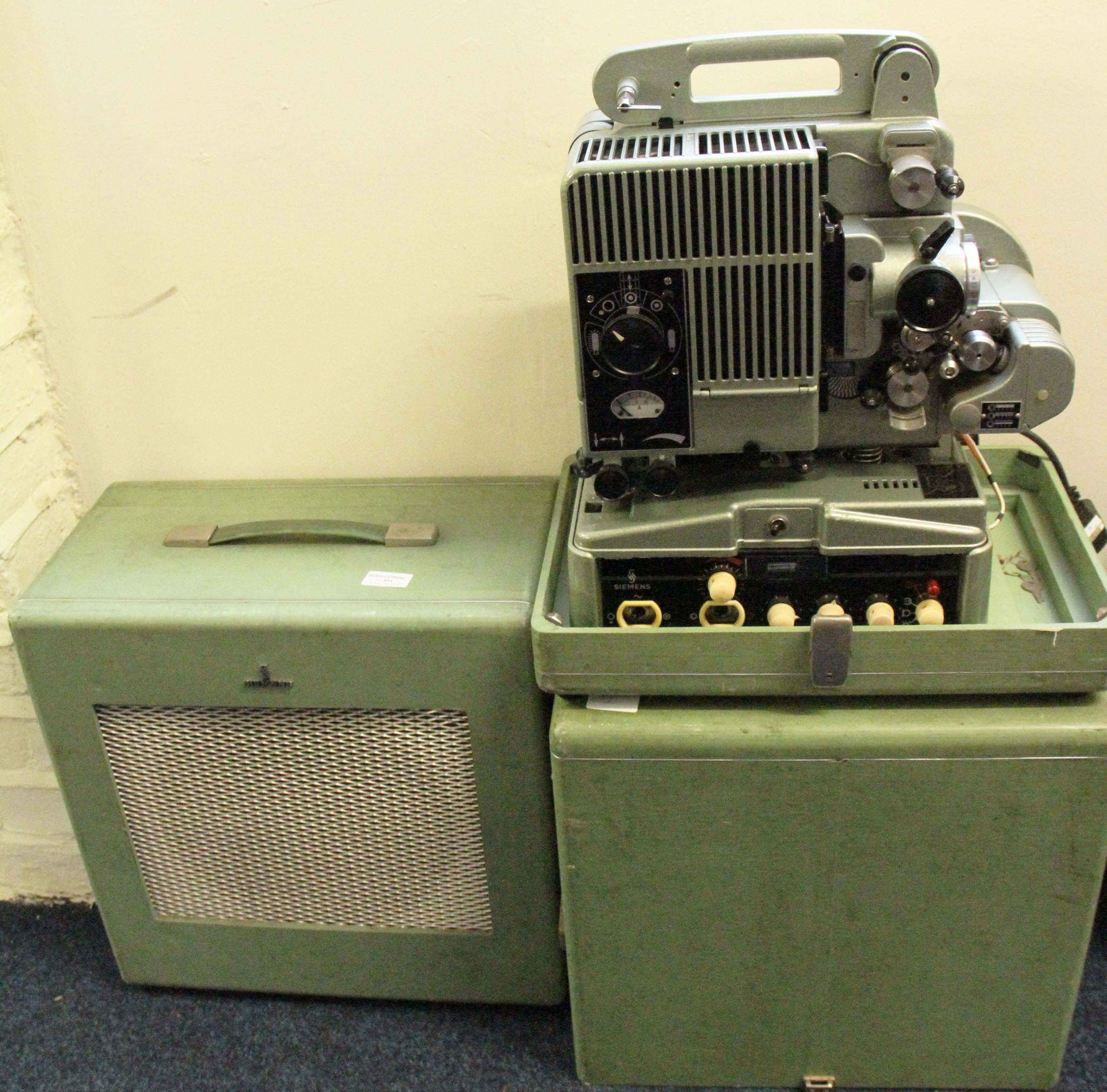 A Siemens 16mm projector in case with matching extension speaker.