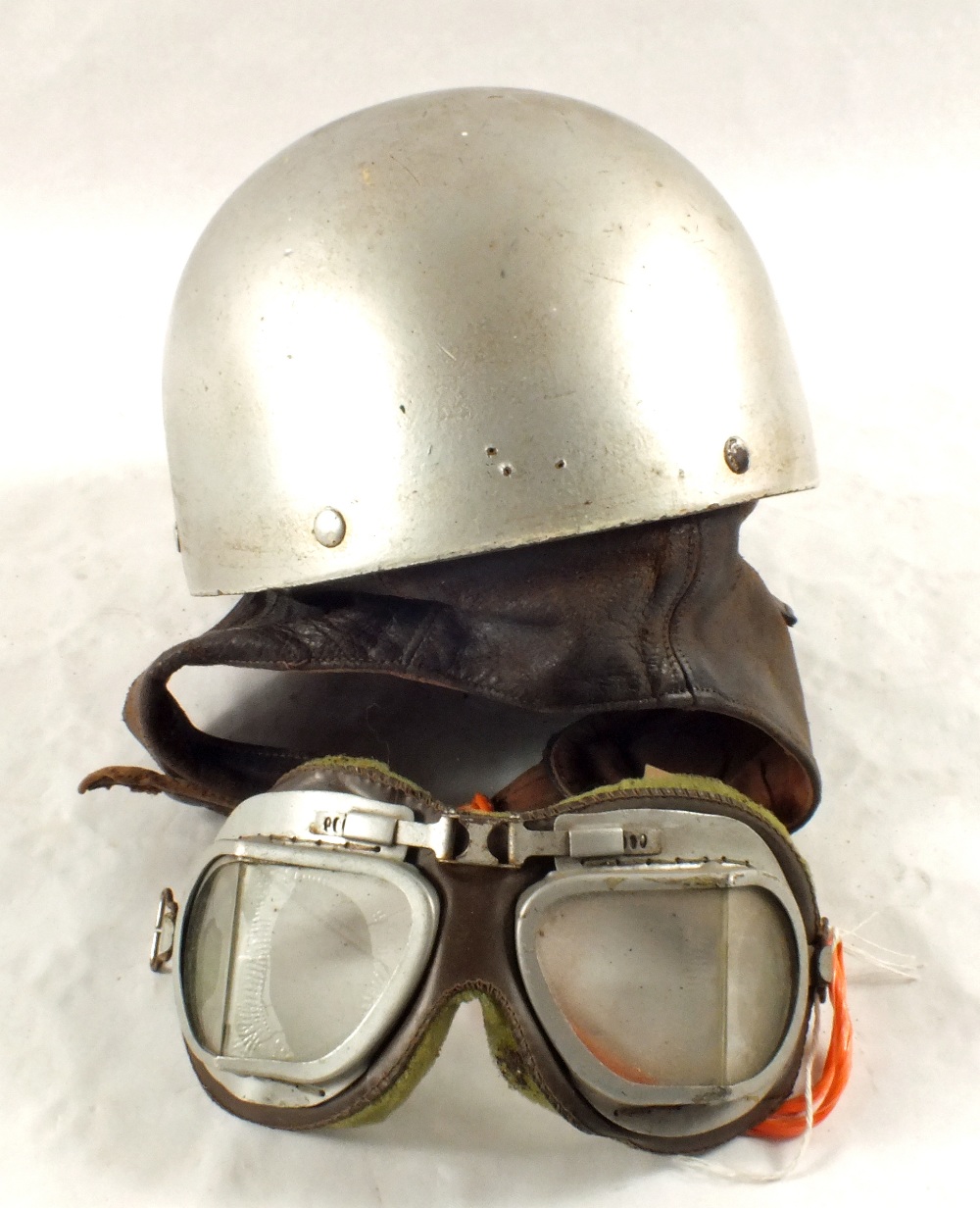 A vintage pudding basin motorcycle helmet with Matchless logo and a