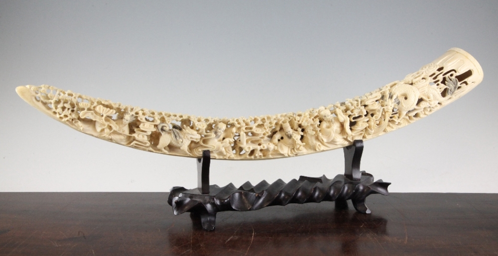 A Chinese ivory tusk carving of the Eight Immortals, early 20th century