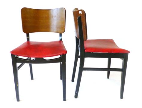A Set Four Beautility Teak And Ebonised Wood Framed Dining Chairs With Red Vinyl Upholstered Seat