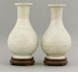 A good pair of Qingbai Vases,  Southern Song dynasty (1127-1279), each ovoid body moulded with